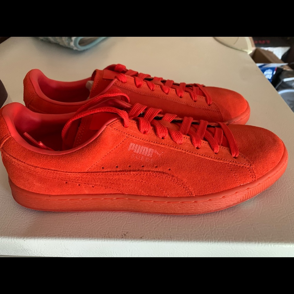 Orange suede pumas